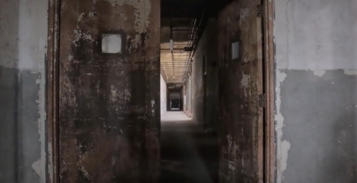 An abandoned corridor inside the hospital, looking ruinous